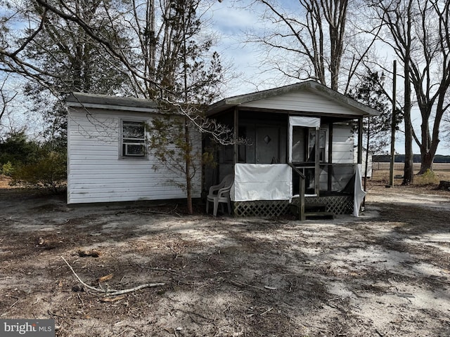 view of front of property featuring a sunroom