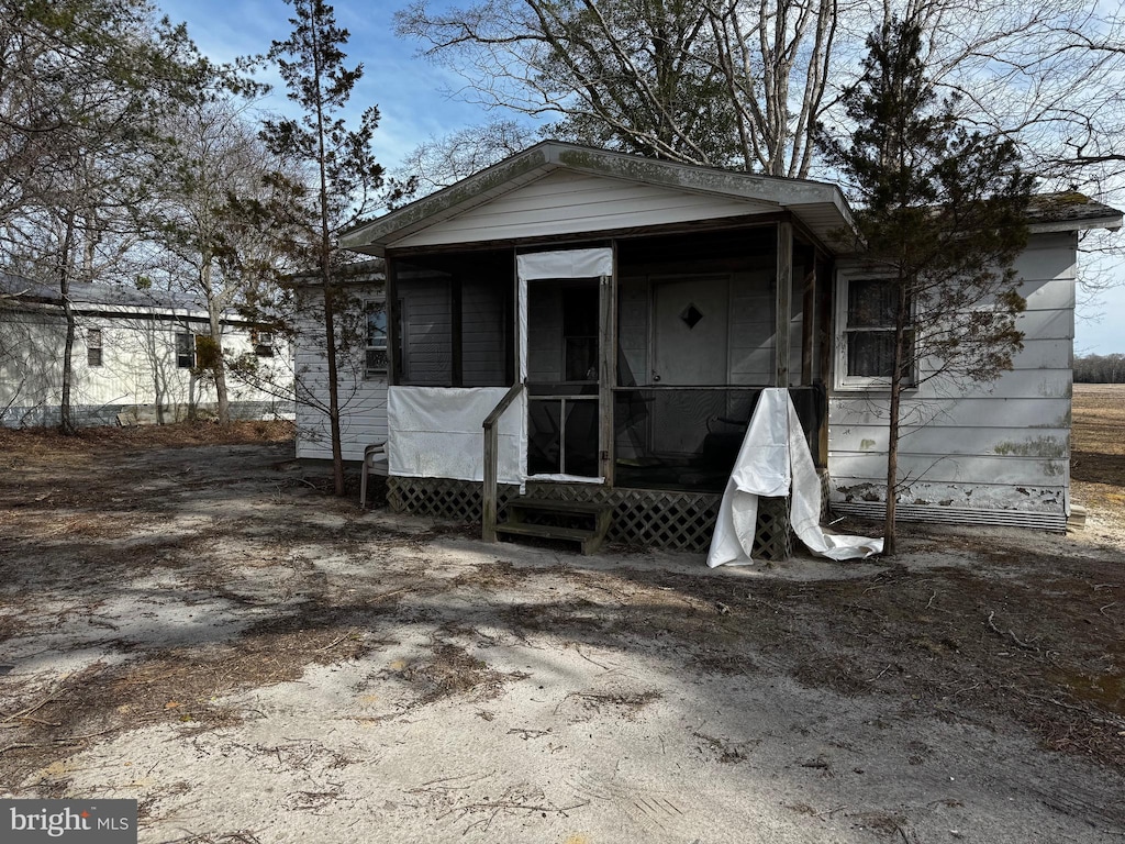 back of property featuring a sunroom