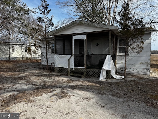 back of property featuring a sunroom