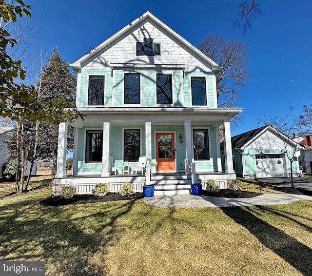 view of front of home with covered porch and a front lawn