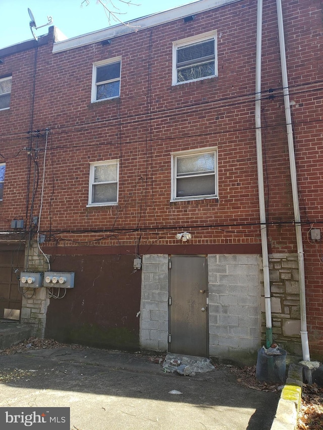 exterior space featuring brick siding