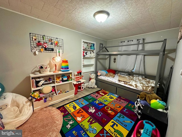 bedroom with wood finished floors