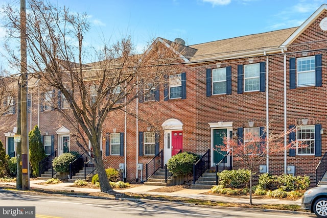 view of property featuring brick siding