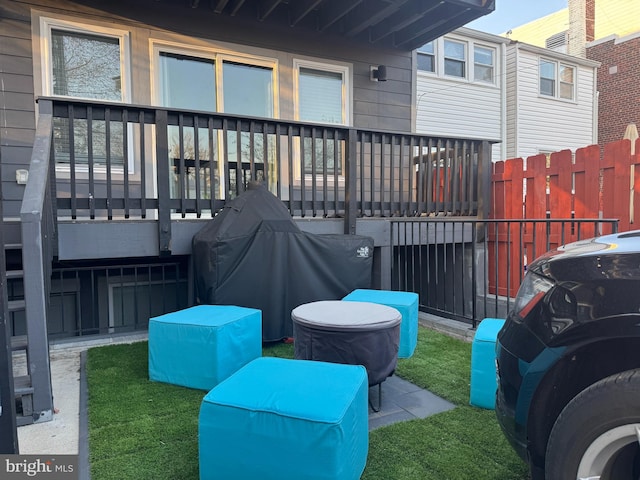 view of patio featuring grilling area and fence