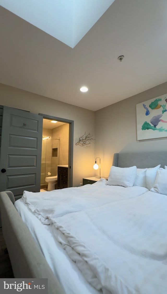 bedroom featuring recessed lighting and ensuite bath