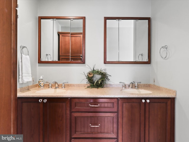 bathroom featuring double vanity and a sink