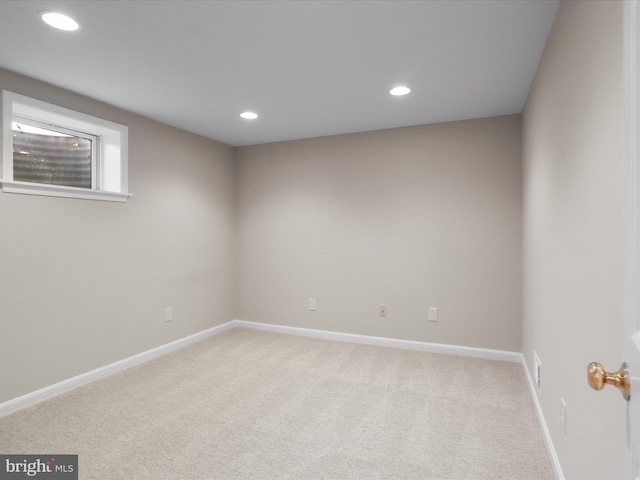 unfurnished room with recessed lighting, light colored carpet, and baseboards