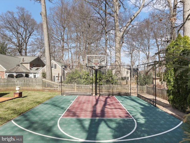 view of basketball court with basketball court and fence