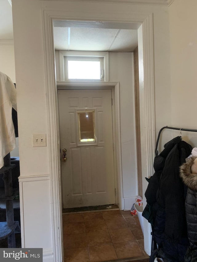 doorway with tile patterned floors