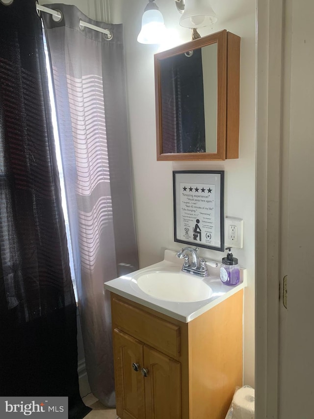 full bathroom with a shower with shower curtain and vanity