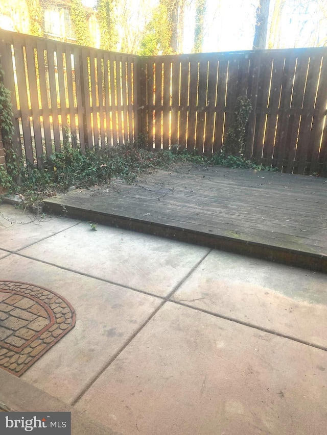 view of patio / terrace featuring a deck and fence