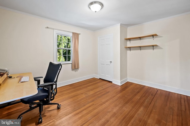 office with crown molding, wood finished floors, and baseboards