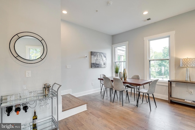 dining area featuring visible vents, recessed lighting, baseboards, and wood finished floors