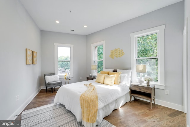 bedroom featuring recessed lighting, baseboards, and wood finished floors