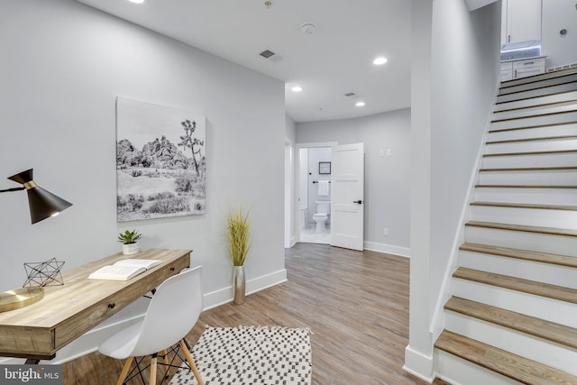 office area featuring visible vents, recessed lighting, light wood-style floors, and baseboards