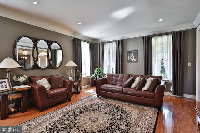 living room featuring recessed lighting, baseboards, wood finished floors, and crown molding