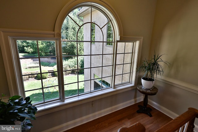 details featuring wood finished floors and baseboards