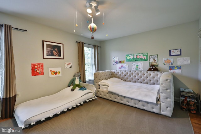 bedroom with wood finished floors