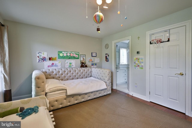 bedroom with baseboards and wood finished floors