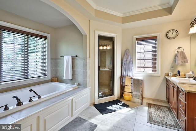 full bath featuring a shower stall, crown molding, a garden tub, tile patterned floors, and vanity