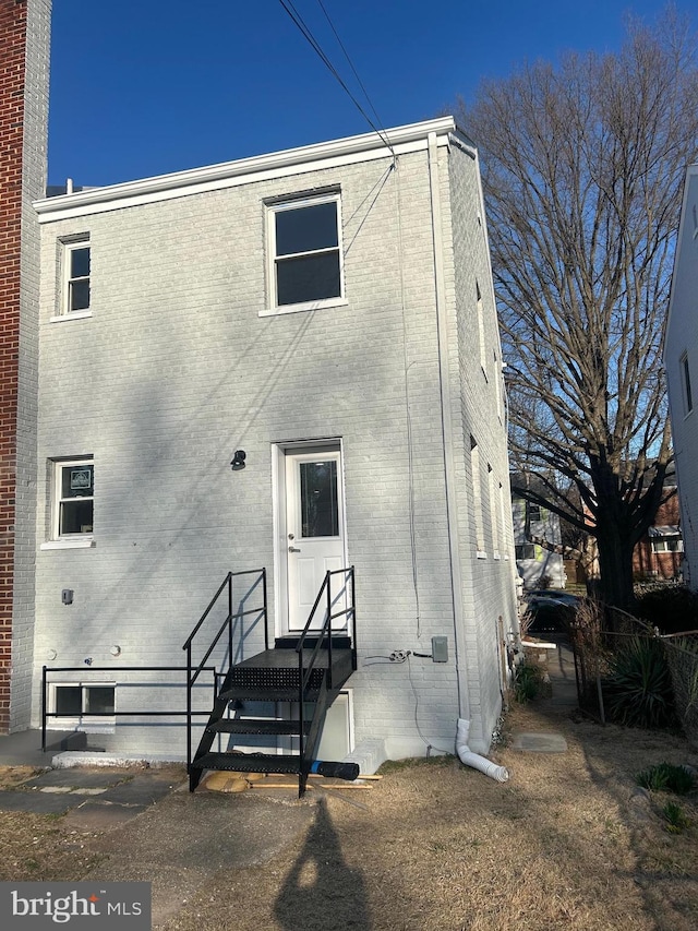 view of front of home with brick siding