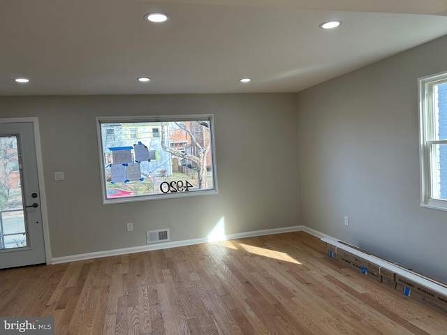 entryway featuring visible vents, recessed lighting, a healthy amount of sunlight, and wood finished floors