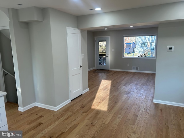 interior space with recessed lighting, baseboards, and light wood-type flooring