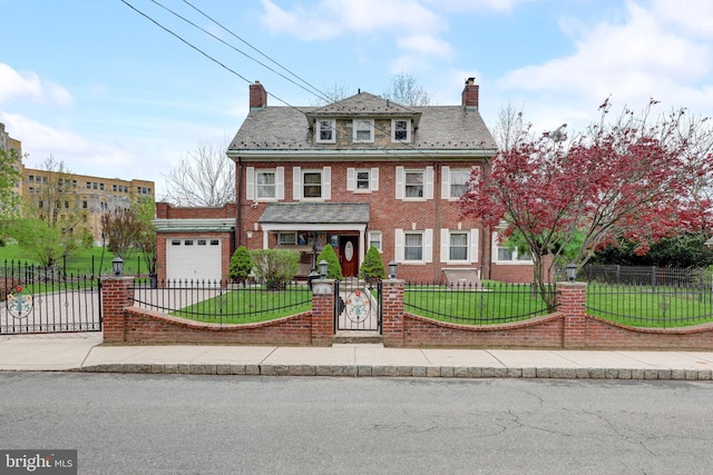 traditional style home featuring a front lawn, brick siding, and a fenced front yard