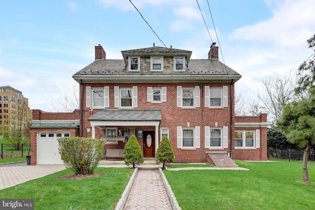 view of front of home with brick siding, a front lawn, fence, a chimney, and decorative driveway