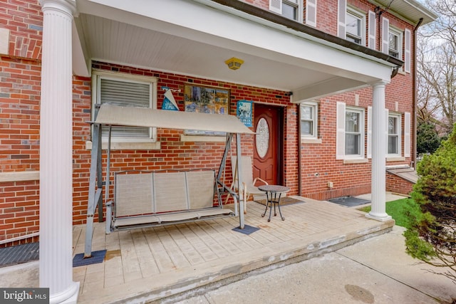 entrance to property with brick siding