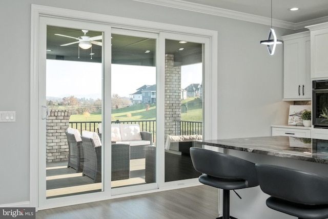 dining area featuring recessed lighting, crown molding, a ceiling fan, and wood finished floors