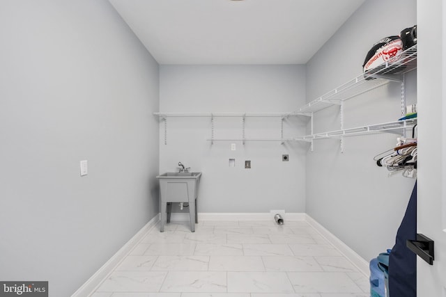 washroom featuring baseboards, washer hookup, laundry area, marble finish floor, and electric dryer hookup