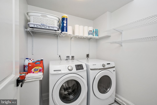 laundry room with laundry area and washing machine and dryer