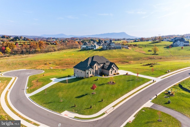 birds eye view of property with a mountain view