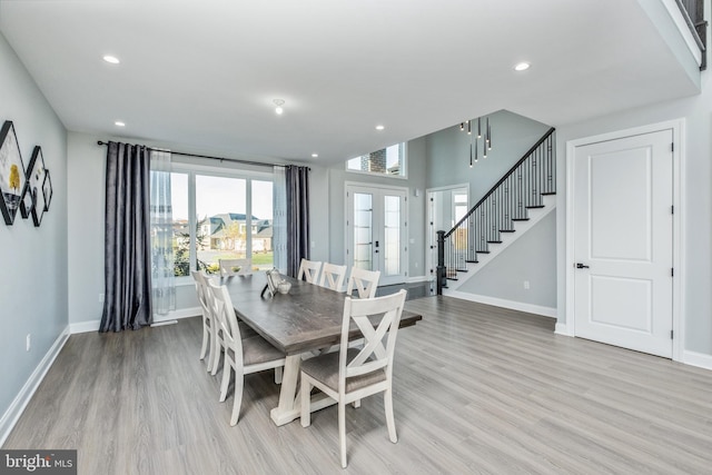 dining room featuring recessed lighting, stairway, french doors, light wood finished floors, and baseboards