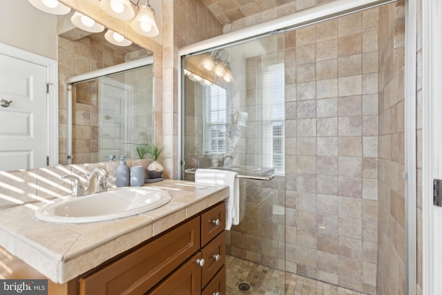 full bath featuring a shower stall and vanity