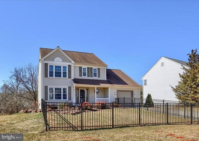 traditional-style house with a fenced front yard, a garage, and a front lawn