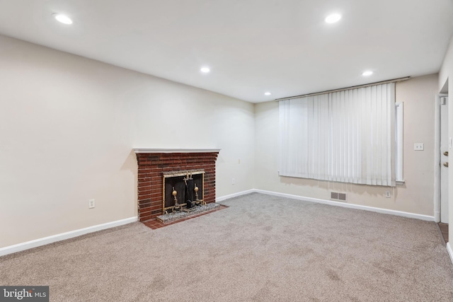 unfurnished living room with recessed lighting, carpet, and visible vents