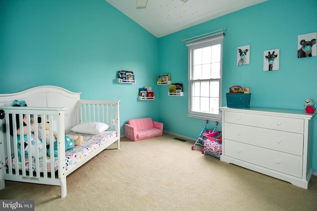 bedroom featuring visible vents, a ceiling fan, carpet, baseboards, and vaulted ceiling