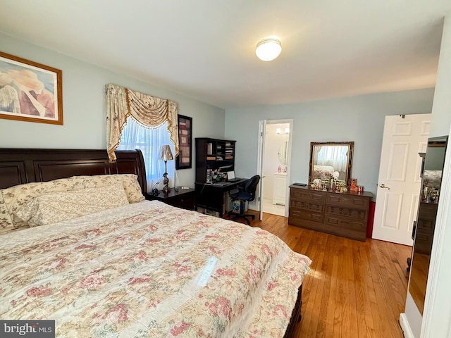 bedroom with wood finished floors