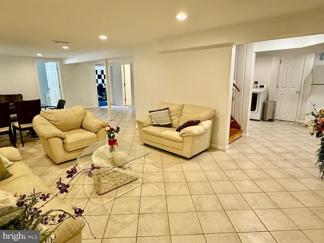 living area featuring stairs, washer / clothes dryer, recessed lighting, and light tile patterned floors