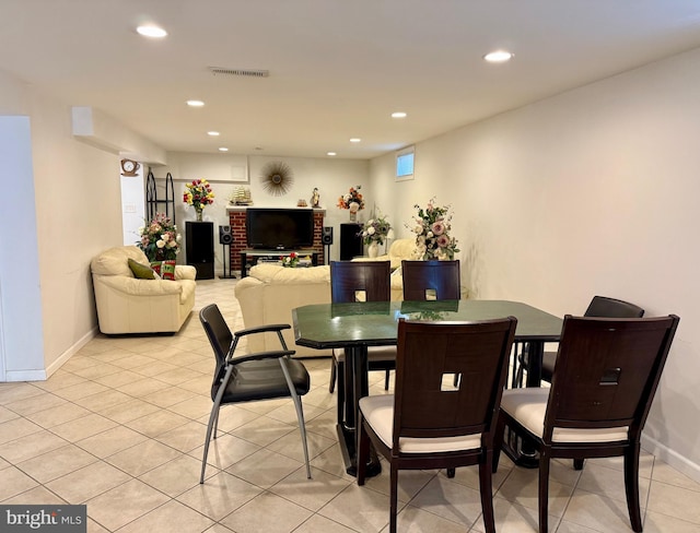 dining space featuring recessed lighting, baseboards, and light tile patterned floors