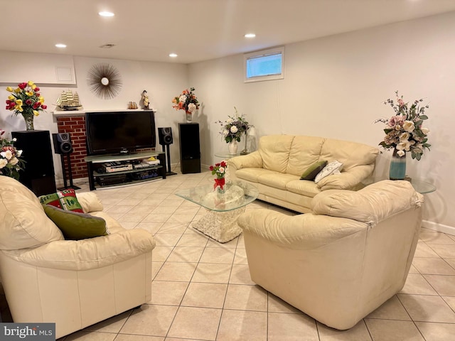 living area with light tile patterned floors and recessed lighting