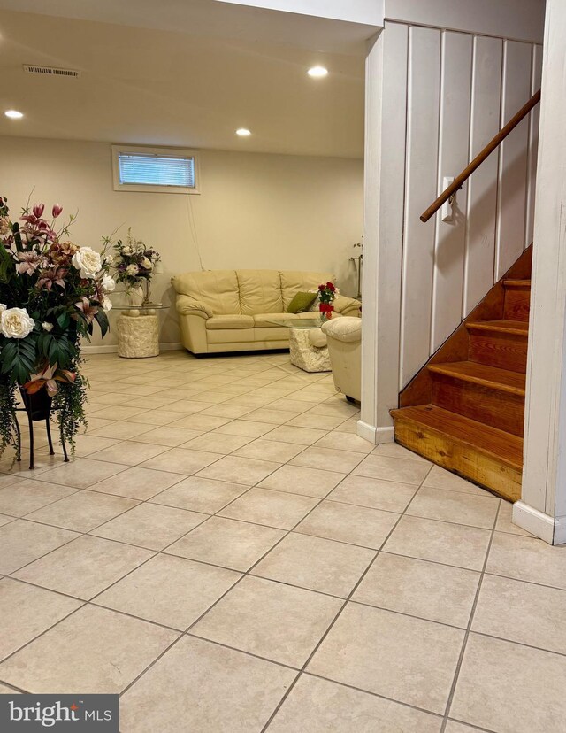 living area with visible vents, recessed lighting, stairway, light tile patterned floors, and baseboards