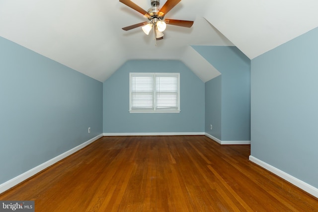 bonus room with vaulted ceiling, ceiling fan, baseboards, and wood finished floors