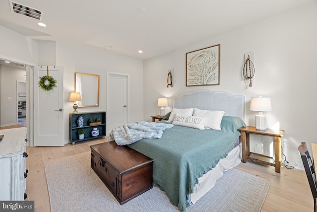 bedroom featuring recessed lighting, visible vents, and light wood-style flooring