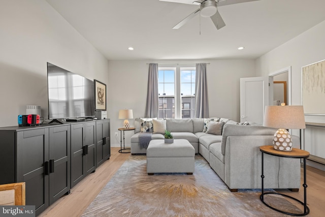 living area with a ceiling fan, recessed lighting, and light wood-style floors