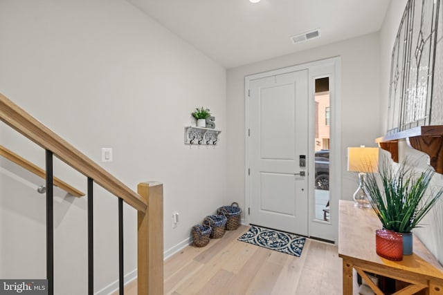 entrance foyer featuring wood finished floors and visible vents