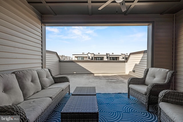 view of patio featuring a ceiling fan, outdoor lounge area, and a balcony