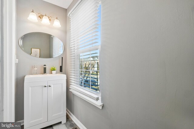 bathroom with vanity and baseboards